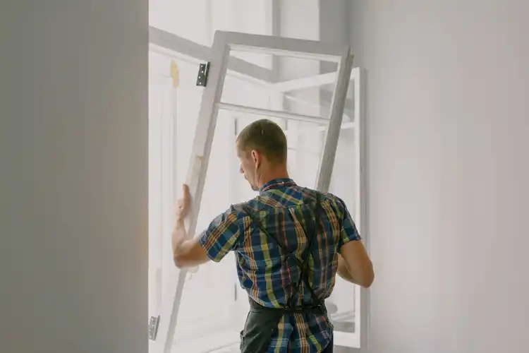 Installer fitting a window
